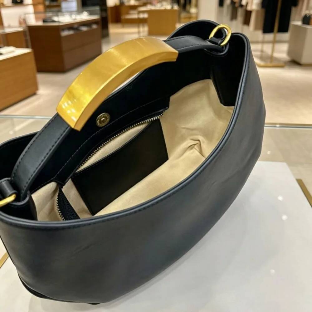 Halvemaanvormige dames handtas - Luxury Bags Online recensie en prijs