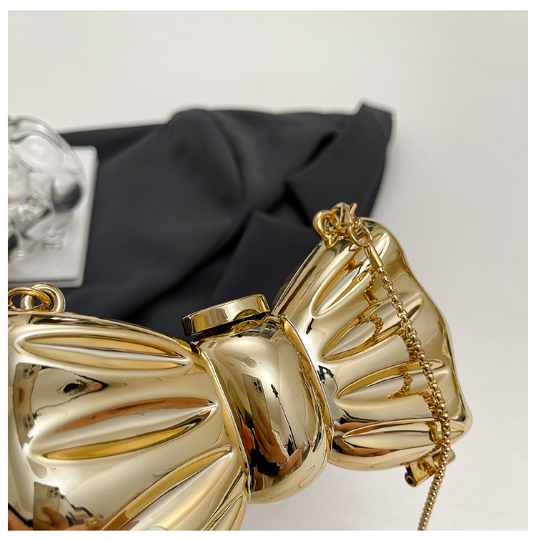 Glanzende gouden metalen strik - Luxury Bags Gold recensie en prijs